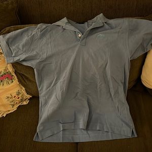 Light Blue Collared Shirt With A “WESTLAWN GRAFIC” on it.